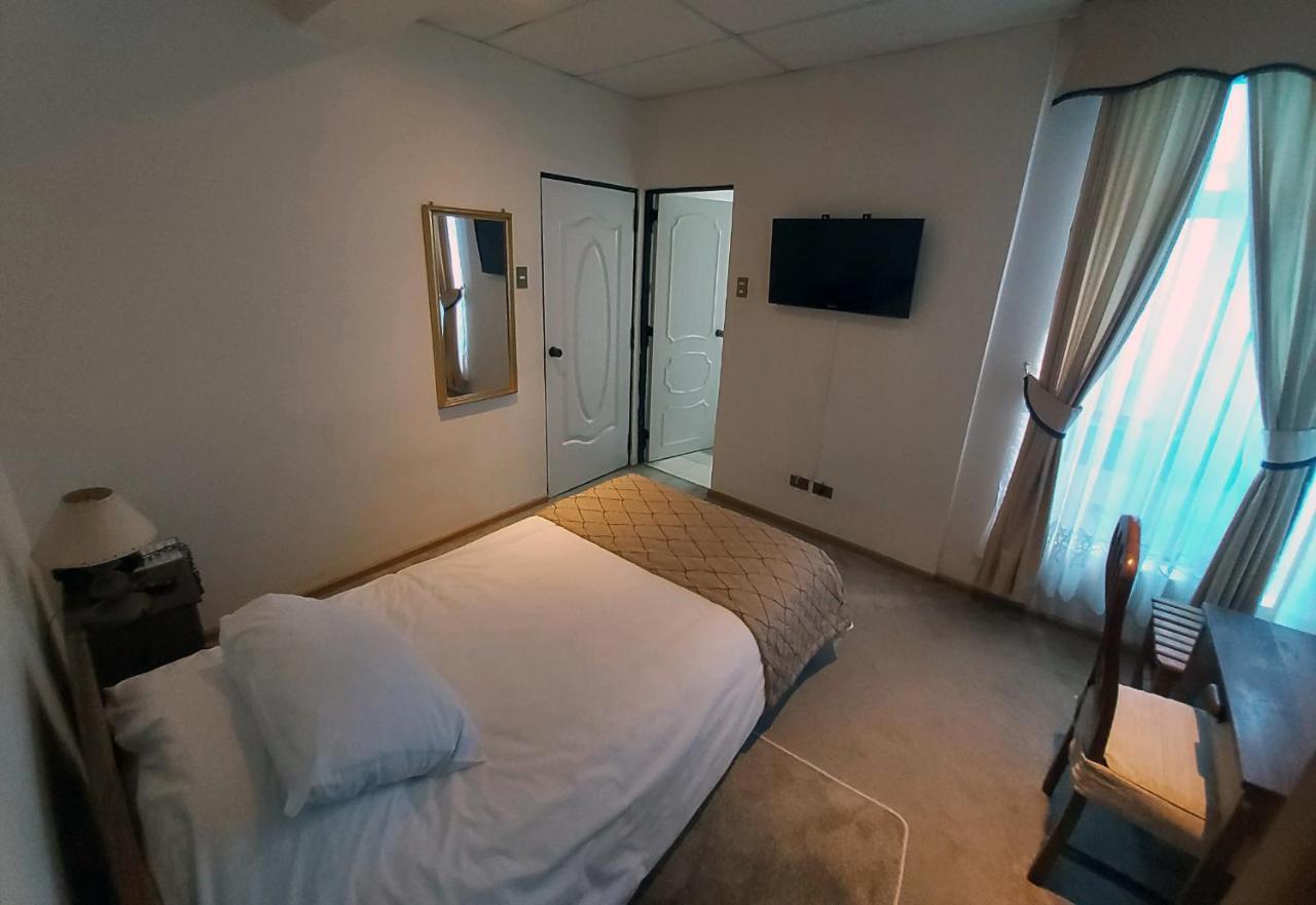 Hotel Esmeralda Castro Værelse billede